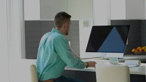 Young businessman working on computer Stock Footage 104321988