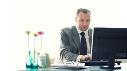 Young businessman working on computer in the office HD Stock Footage 4423612