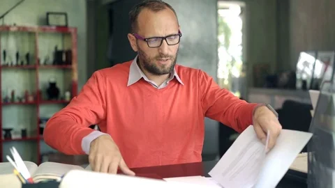 Young businessman working with documents and go away, 4K Stock Footage 74849988