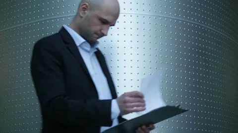 Young businessman working with documents Stock Footage 10954161