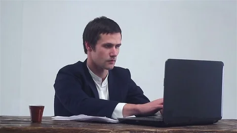 Young businessman working on a notebook,. Stock-Footage 73024072