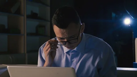 A young businessman working on a project, difficulties, defects in working, sad Stock Footage 98304447