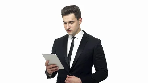 Young businessman working on tablet computer isolated on white background Stock Footage 91493713