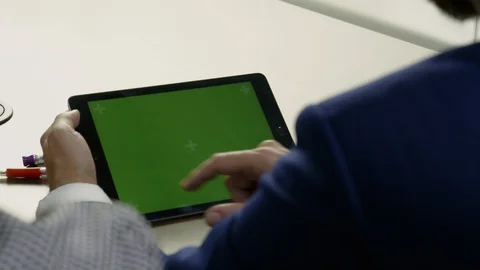 Young businessman working on a tablet. 스톡 동영상 101893773