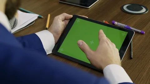 Young businessman working on a tablet. 스톡 동영상 101898142