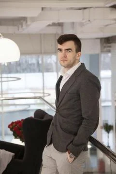 Young businessman works in an office with documents and electronic devices Foto stock