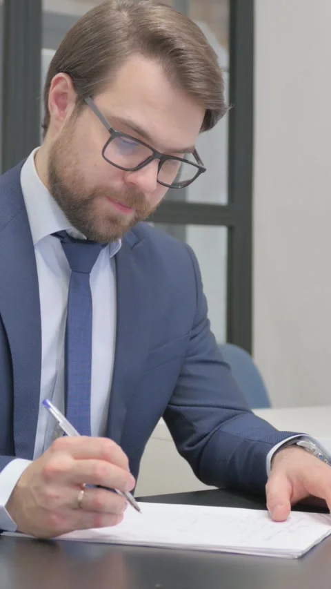 Young Businessman Writing Documents at Work Video stock 321108858