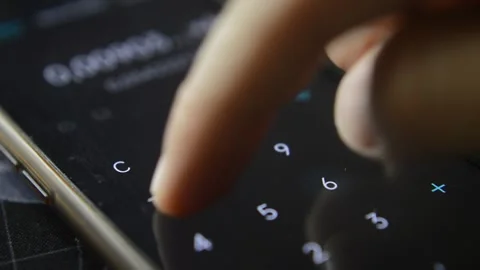 Young businessman's hand using calculator on his phone for business Stock-Footage 195986544