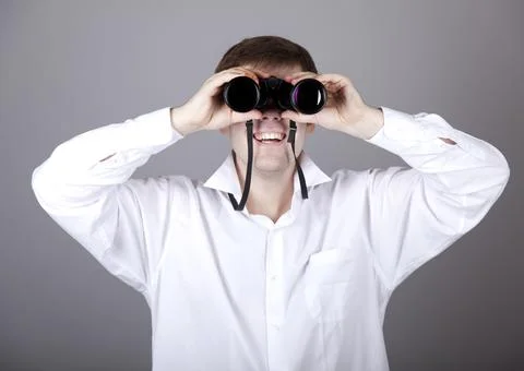 Young businessmen in t-shirt with black binocular Stock Photos