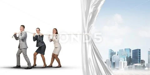 Young businesspeople working in collaboration and pulling white advertisement Stock Photos