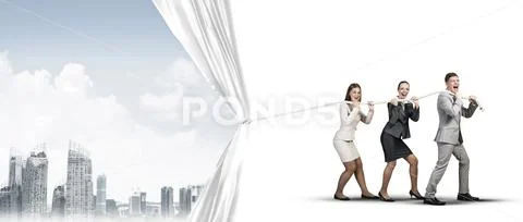 Young businesspeople working in collaboration and pulling white advertisement Stock Photos