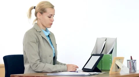 Young businesswoman chatting on tablet computer in the office HD Stock Footage