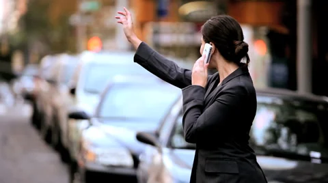 Young Businesswoman Hailing a Cab Stock Footage