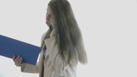 Young businesswoman over white background talking on the phone Stock Footage