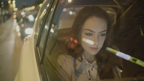 Young Businesswoman Using a Tablet Computer in the Moving Car Video stock 97935659