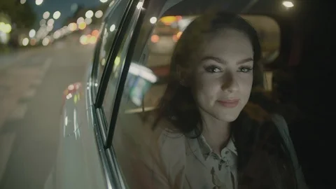 Young Businesswoman Using a Tablet Computer in the Moving Car Stock Footage 97940581
