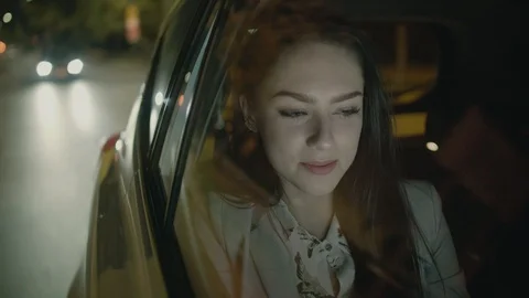 Young Businesswoman Using a Tablet Computer in the Moving Car Stock Footage 97951551