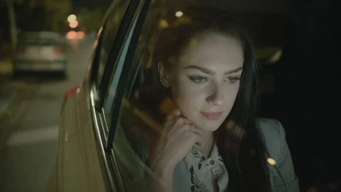 Young Businesswoman Using a Tablet Computer in the Moving Car Stock Footage 97951860