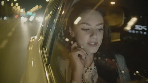 Young Businesswoman Using a Tablet Computer in the Moving Car Stock Footage 97953309