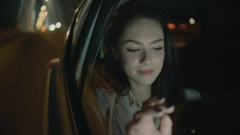 Young Businesswoman Using a Tablet Computer in the Moving Car Stock Footage 97953716