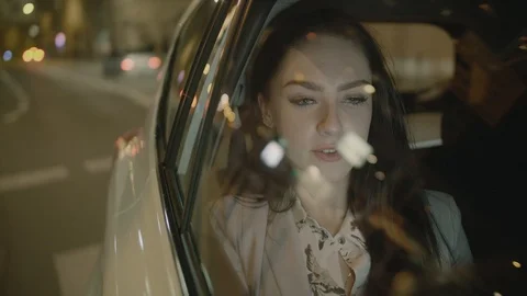 Young Businesswoman Using a Tablet Computer in the Moving Car Stock Footage 97954546