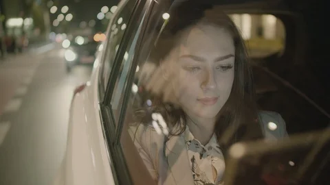Young Businesswoman Using a Tablet Computer in the Moving Car Stock Footage 97954928
