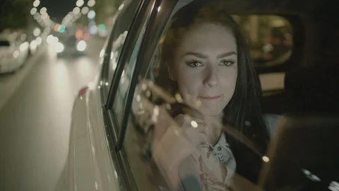 Young Businesswoman Using a Tablet Computer in the Moving Car Stock Footage 97955475