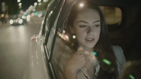Young Businesswoman Using a Tablet Computer in the Moving Car Stock Footage 97956496