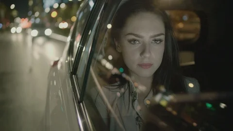 Young Businesswoman Using a Tablet Computer in the Moving Car Stock Footage 97956719