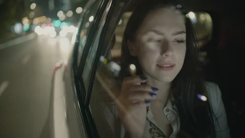 Young Businesswoman Using a Tablet Computer in the Moving Car Stock Footage 97957212