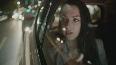 Young Businesswoman Using a Tablet Computer in the Moving Car Stock Footage 97957446