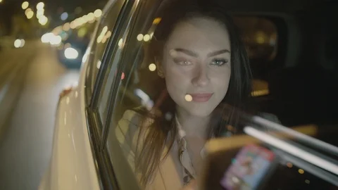 Young Businesswoman Using a Tablet Computer in the Moving Car Stock Footage 97994035