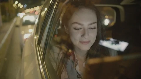 Young Businesswoman Using a Tablet Computer in the Moving Car Stock Footage 97994802