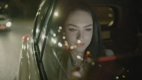 Young Businesswoman Using a Tablet Computer in the Moving Car Stock Footage 97995449