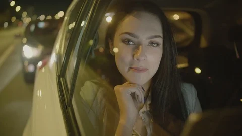 Young Businesswoman Using a Tablet Computer in the Moving Car Stock Footage 97996007