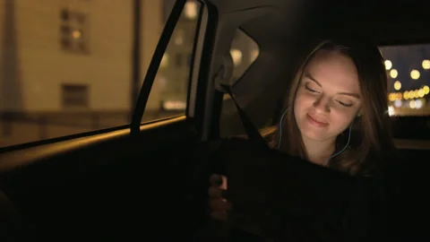 Young Businesswoman Using a Tablet Computer in the Car Stock Footage 123166060