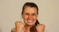 Young businesswoman victorious double fist pump HD Footage