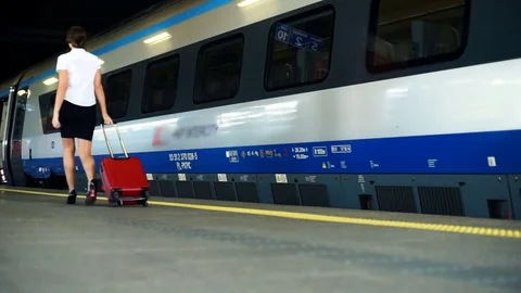 Young businesswoman walking on her train Stock Footage