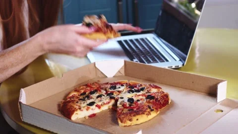 Young Busy Worker Freelancer Woman Eat Pizza In Kitchen, Working In Internet. Stock-Footage 168711853