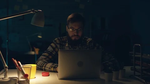 Young Capable Architectural Engineer Working Late Hours in His Office. Office is Stock-Footage 105445363