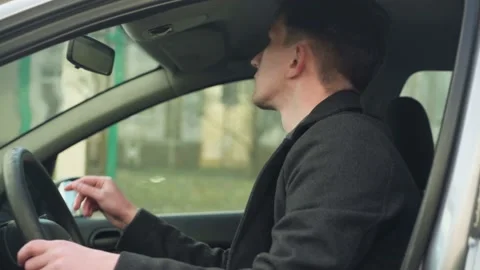 Young car driver inspecting his first car Stock Footage 233355131