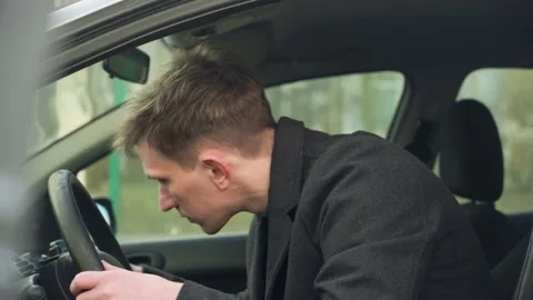 Young car driver inspecting his first car. close-up Stock Footage 233355139