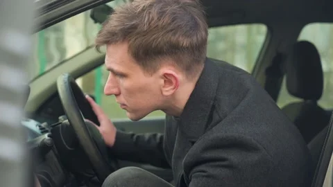 Young car driver inspecting his first car. close-up Stock Footage 234424938