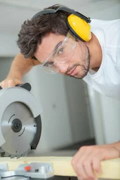 A young carpenter is posing Stock Photos