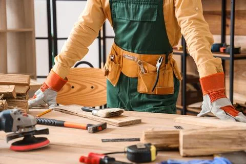 Young carpenter at table in workshop Stock Photos