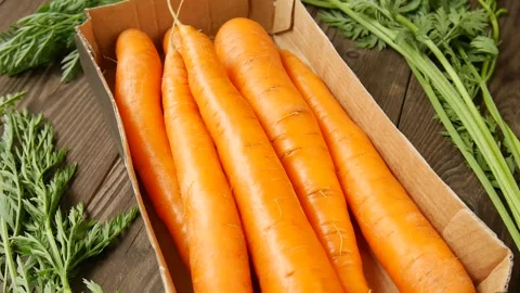 Young carrots on the table. Stock Footage 301863093