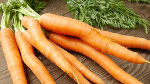 Young carrots on the table. Stock Footage 302707019