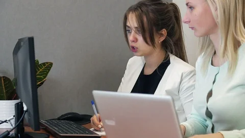 Young Casual business couple using computer in the office. Two colleagues 스톡 동영상 85571192