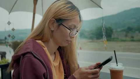 Young casual woman looking at camera Stock Footage 198296820