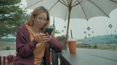 Young casual woman looking at camera Stock Footage 198296828